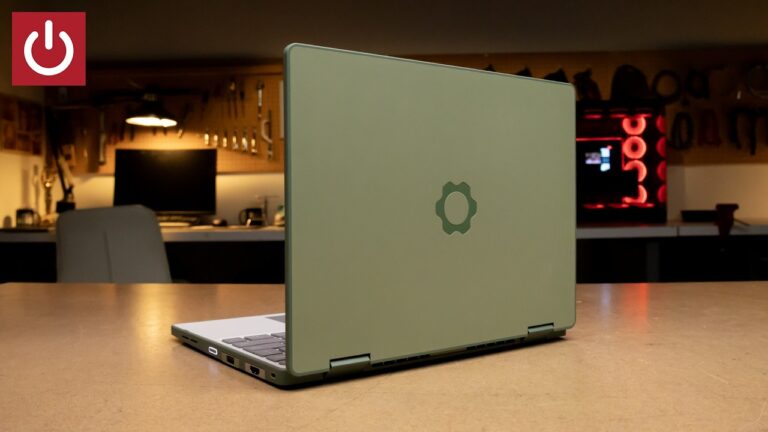 A person holding the Framework Laptop 12 with the screen rotated into a 2-in-1 tablet position.